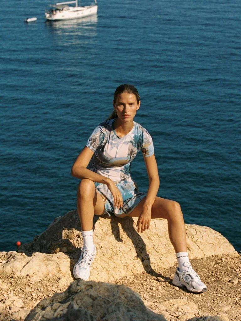 Woman sitting on rocks