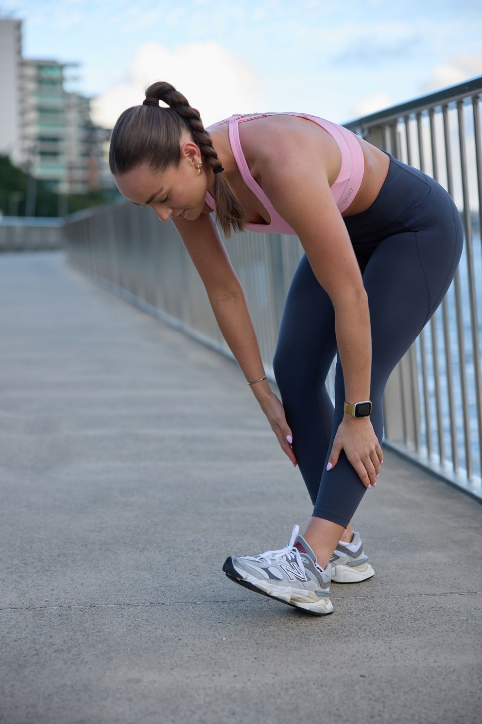 Woman wearing activewear stretching