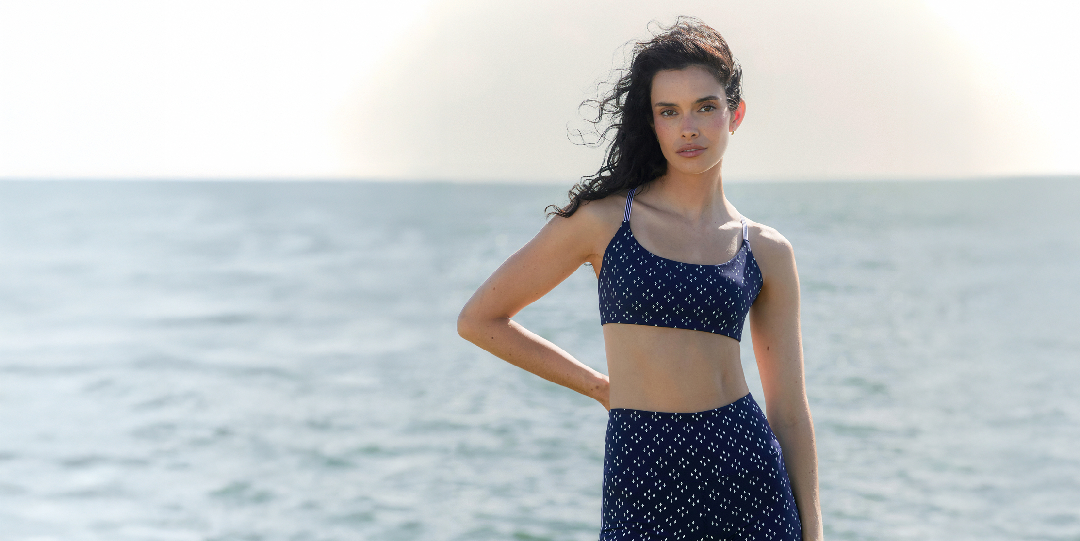 Two women walking on grass