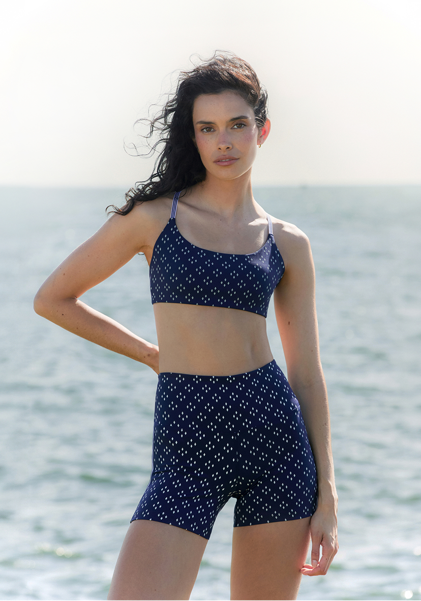 Two women walking on grass