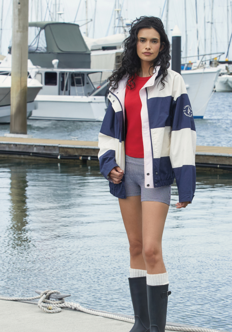 Two women walking on grass