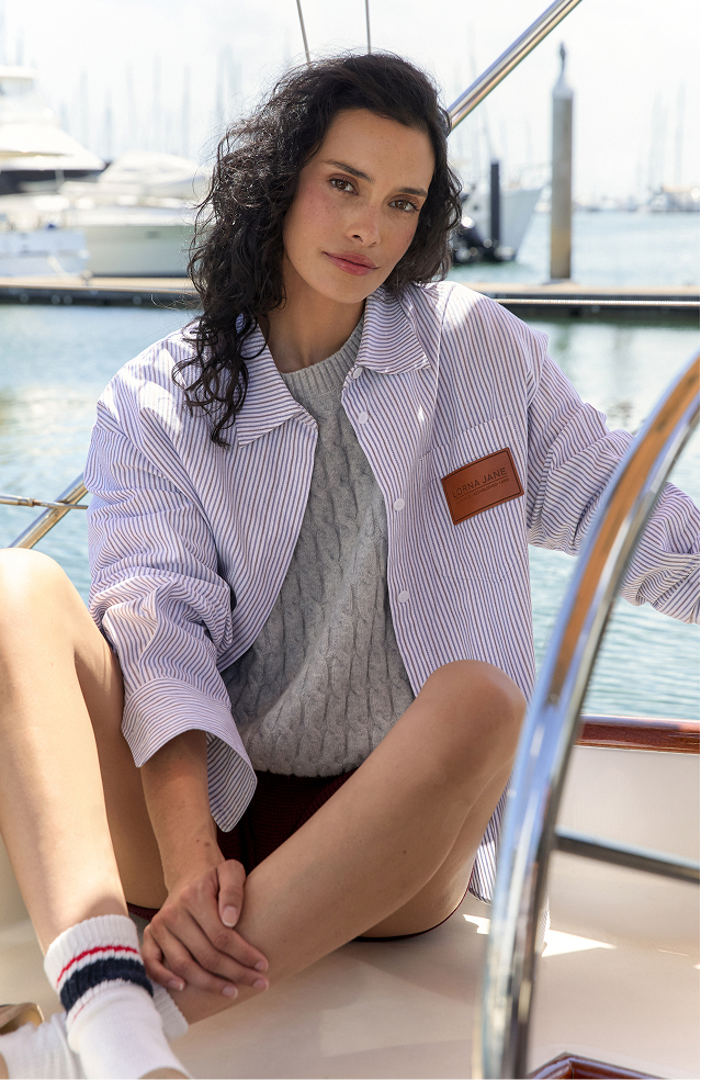 Two women walking on grass