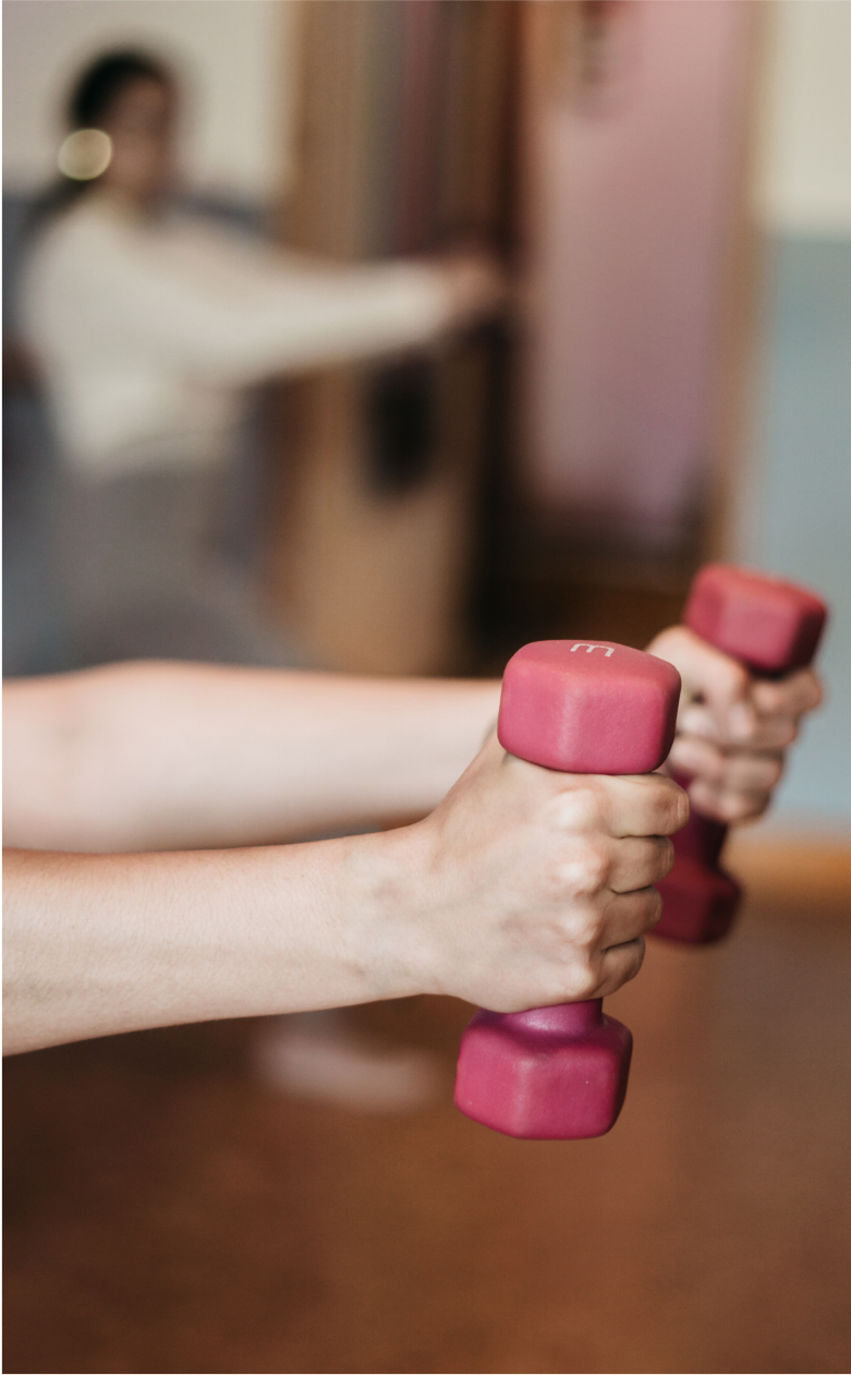 Woman holding dumbbells