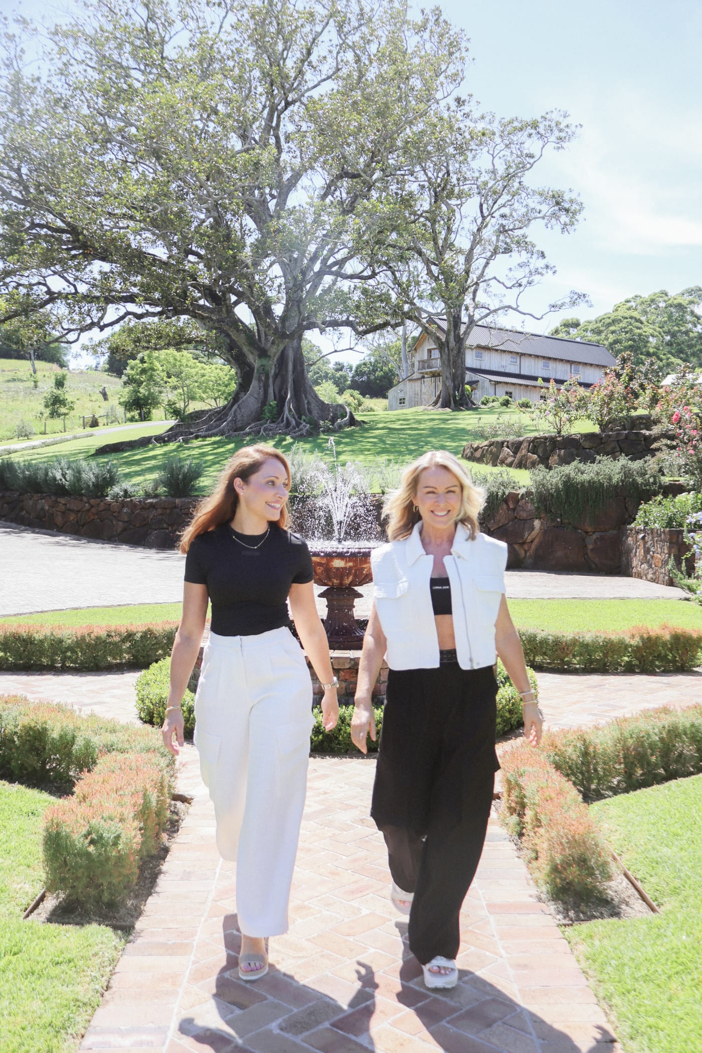 Women walking through a garden