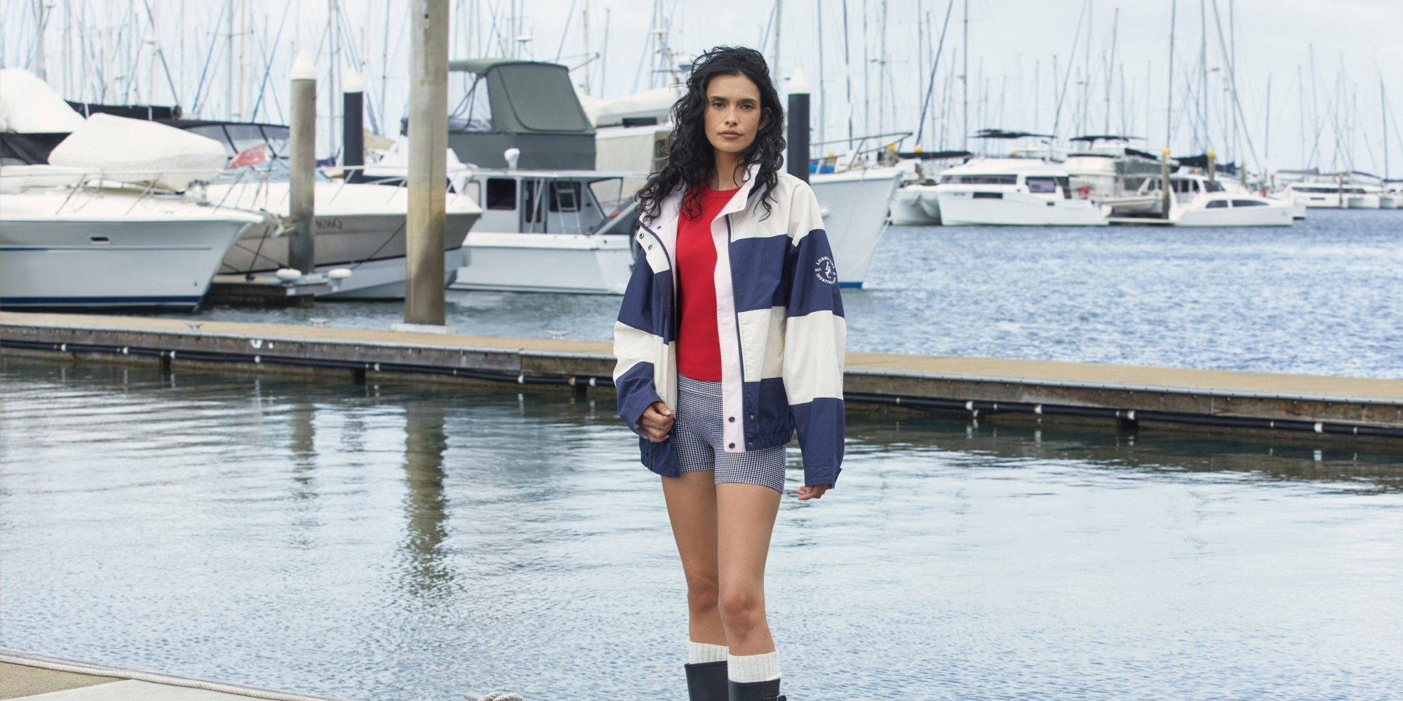 Two women walking on grass