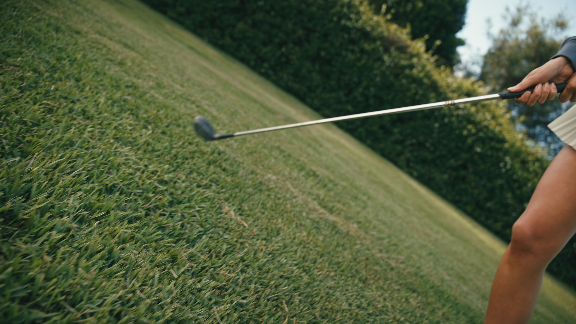 Two women walking on grass