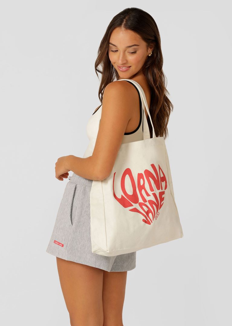 Woman modeling Lorna Jane tote bag