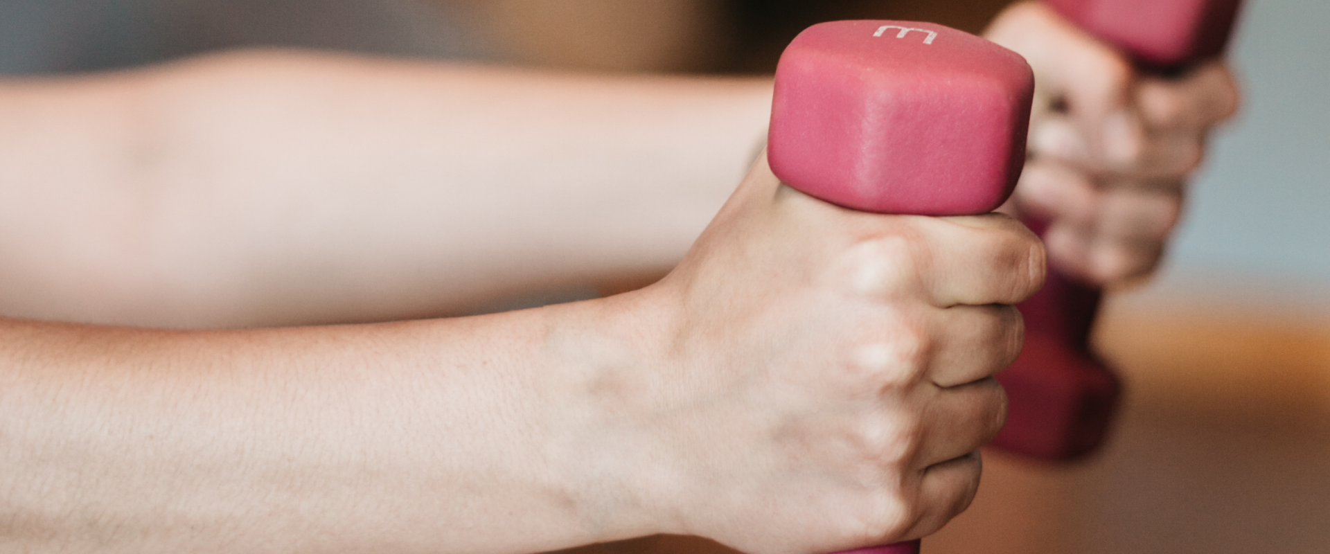 Woman holding dumbbells