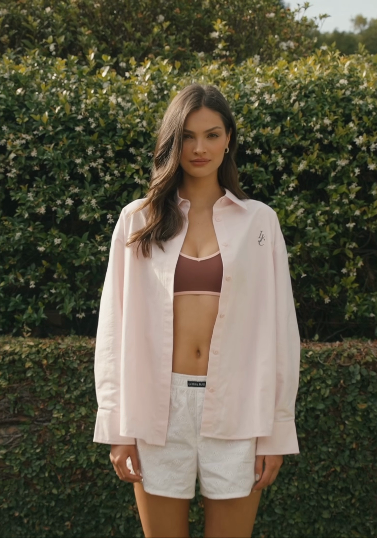 Two women walking on grass