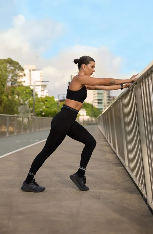 Woman wearing activewear stretching