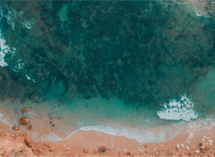 Looking down on a beach and water